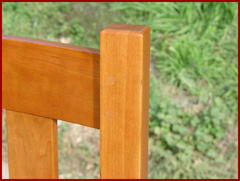 Close-up image of the steam bent crest rail where it meets the top of the back leg. Please note the two dowels which double-pin the mortice and tenon joint together.